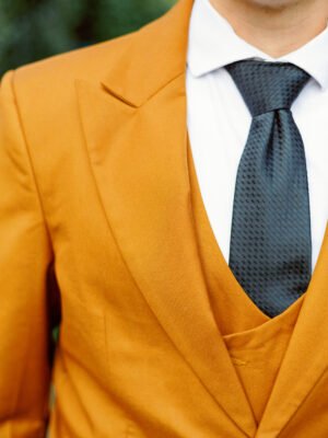 rust_orange_3_piece_suit_single_button_suit_peak_lapel_with_six_button_horshoe_vest_lapel_view