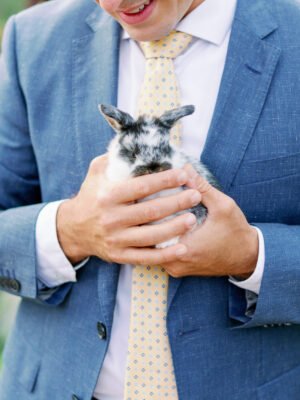 sky_blue_2_piece_2_button_suit_premium_super160s_fabric_front_view_easter_holding_bully_close_up
