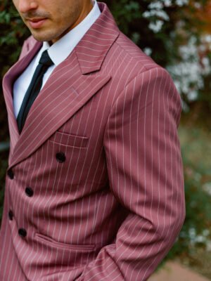 salmon_double_breasted_suit_with_white_pinstripes_side_portait_view
